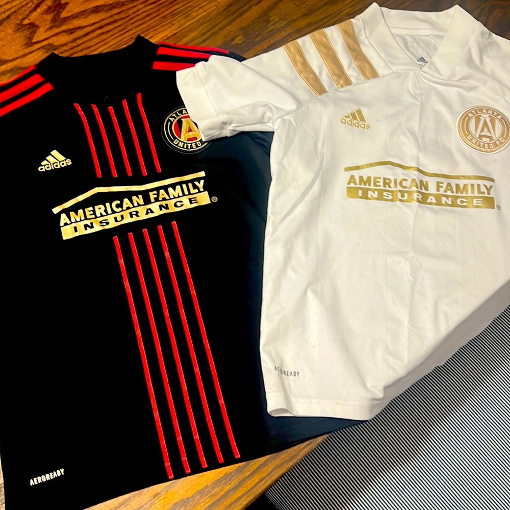2 Atlanta United Youth Jerseys. One white and one black